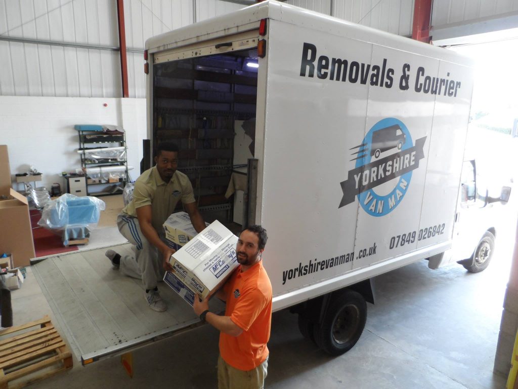 The Yorkshire van man team putting boxes into their van