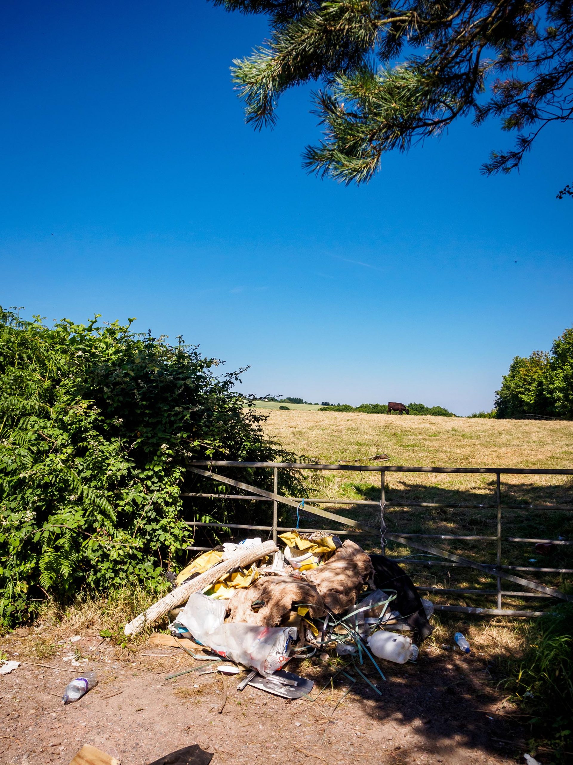 Fly-tipped household furniture, clearance and industrial waste dumped in the countryside